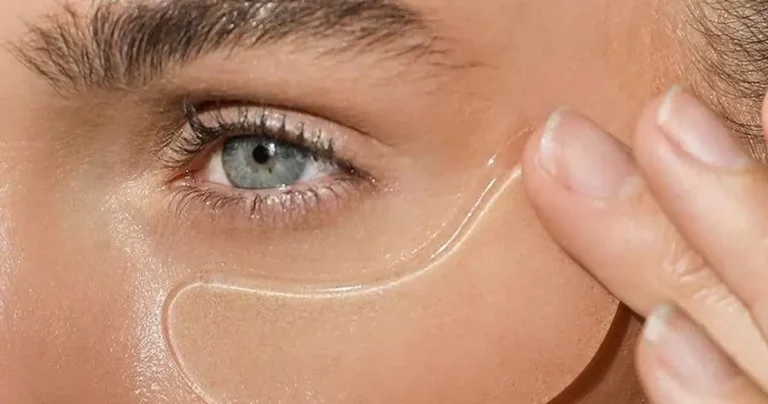 Woman applying a hydrogel under-eye patch, illustrating under-eye care at Accelerated Aesthetics in Elmhurst, IL